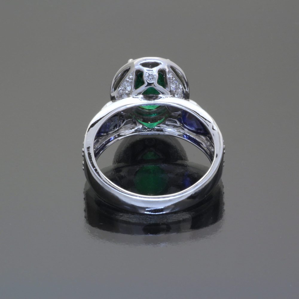 Emerald and sapphire ring with diamonds by Caram