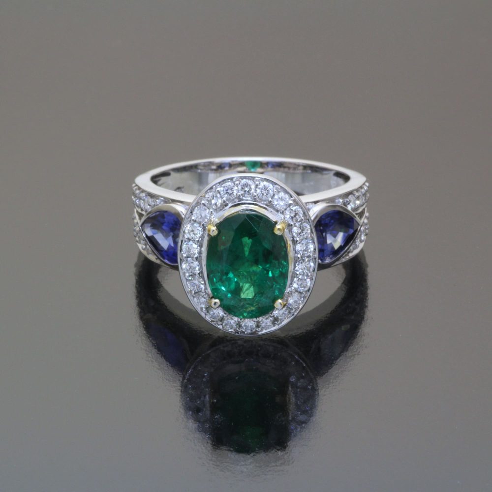 Emerald and sapphire ring with diamonds by Caram